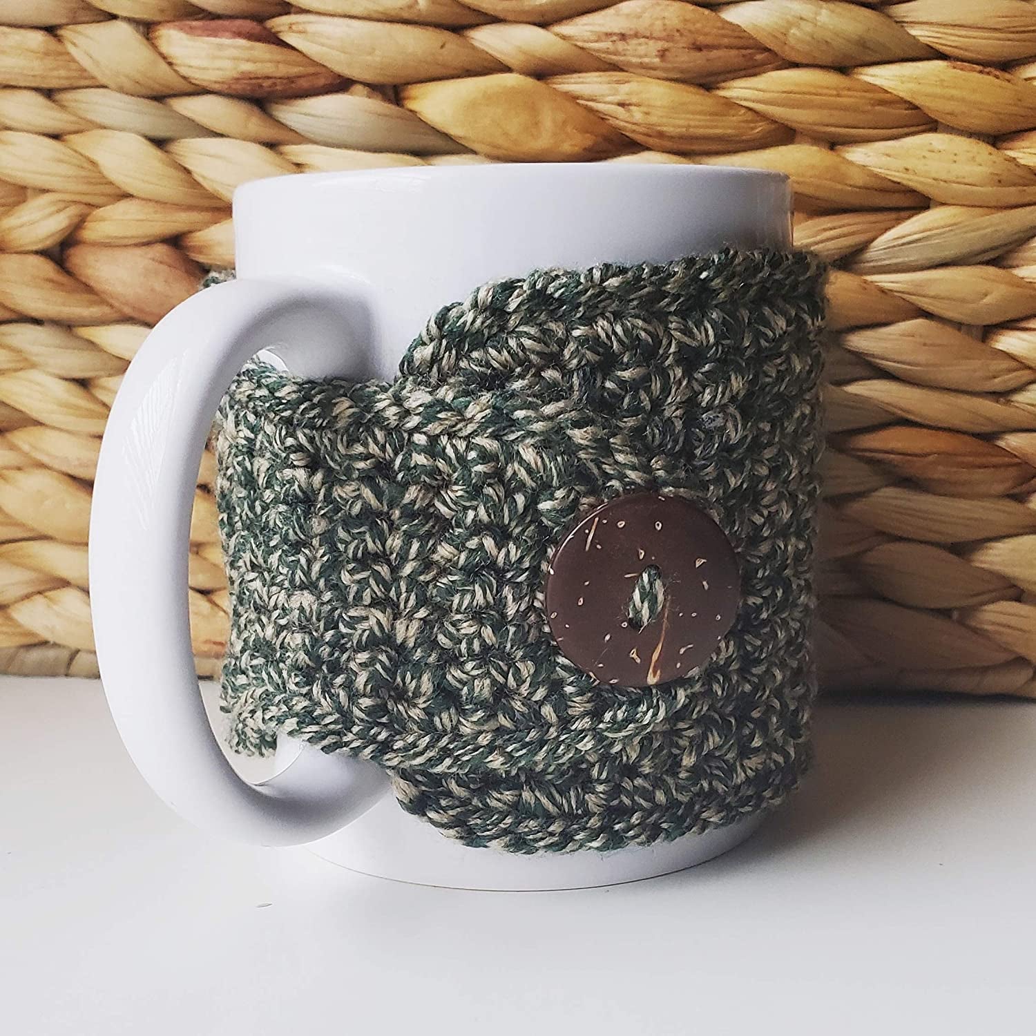 the hunter green cozy on a mug