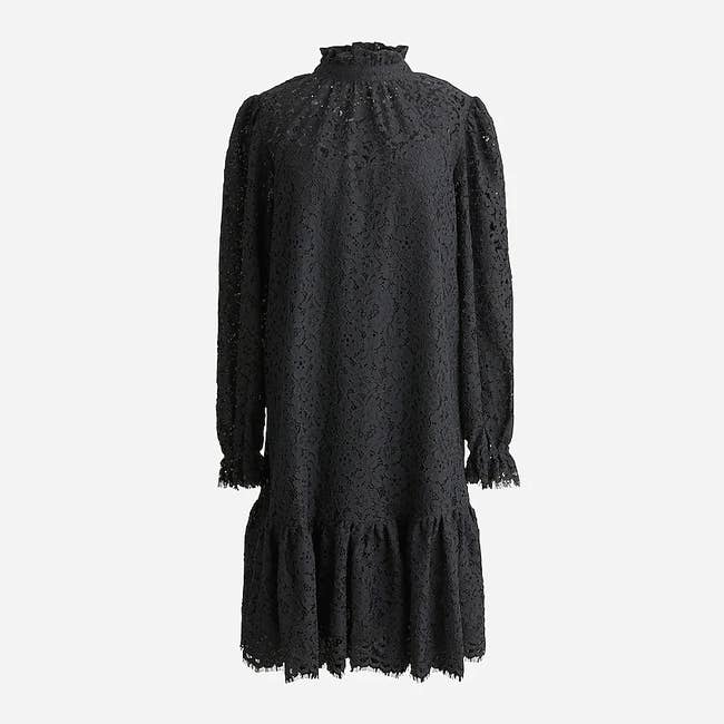 Black lace high-neck dress with ruffled hem and sleeves on a white background