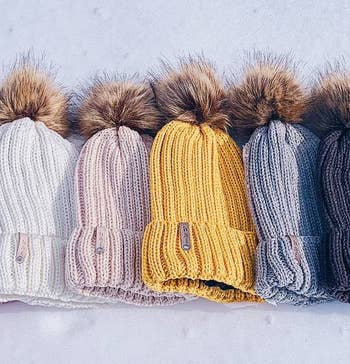 four different color beanies