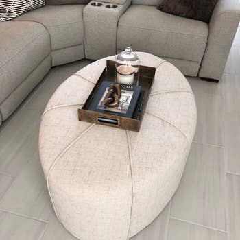reviewer photo of ivory oval ottoman coffee table