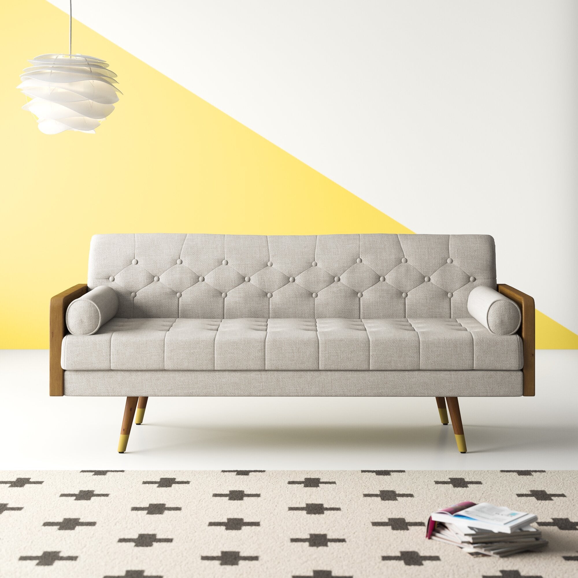 tufted mid century modern sofa with angled legs, two oval pillows, and wood sides