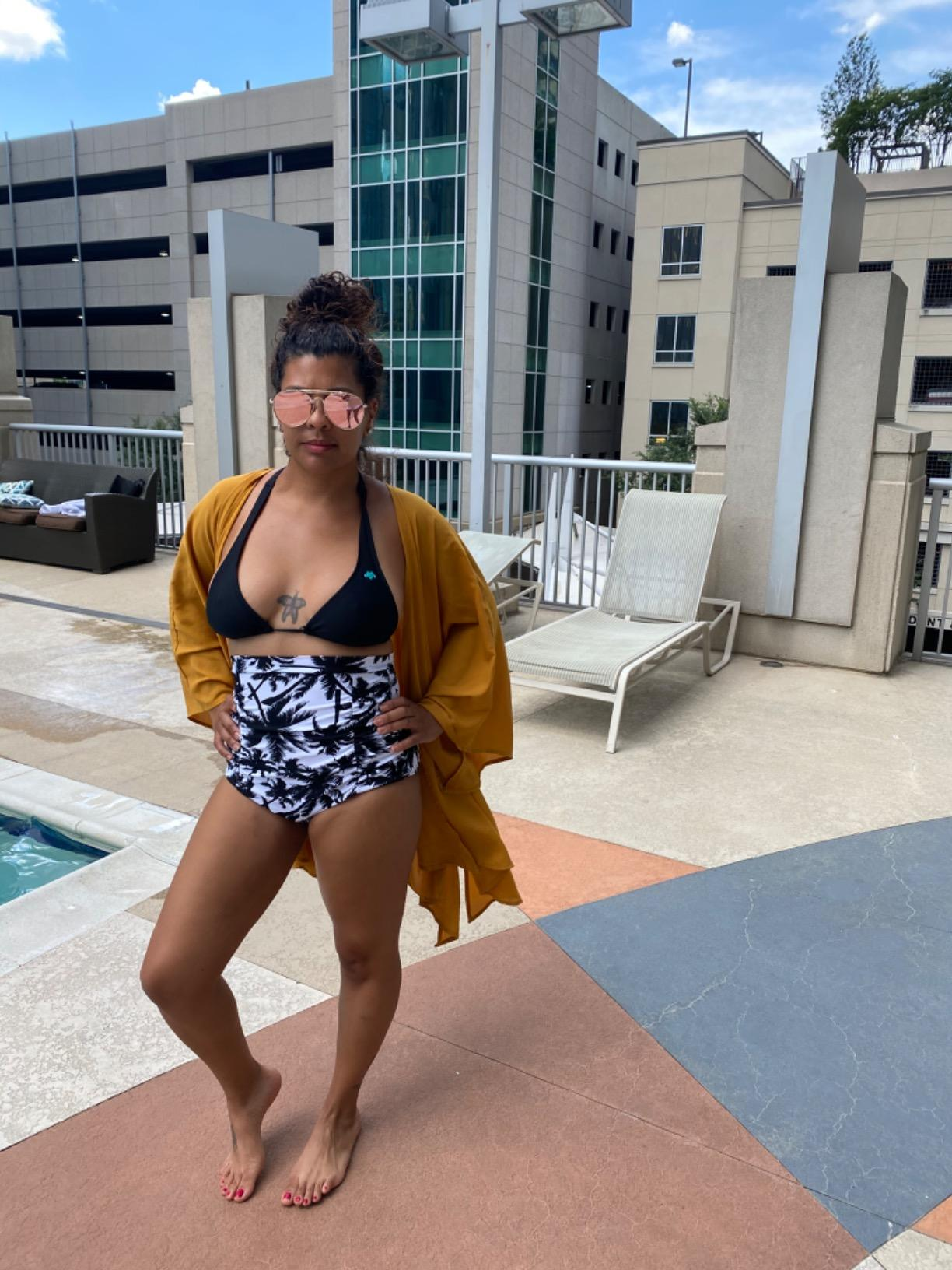 reviewer wearing achromatic  and achromatic  patterned bottoms