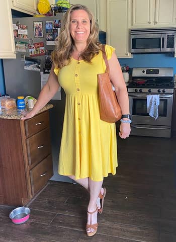 Image of reviewer wearing yellow dress
