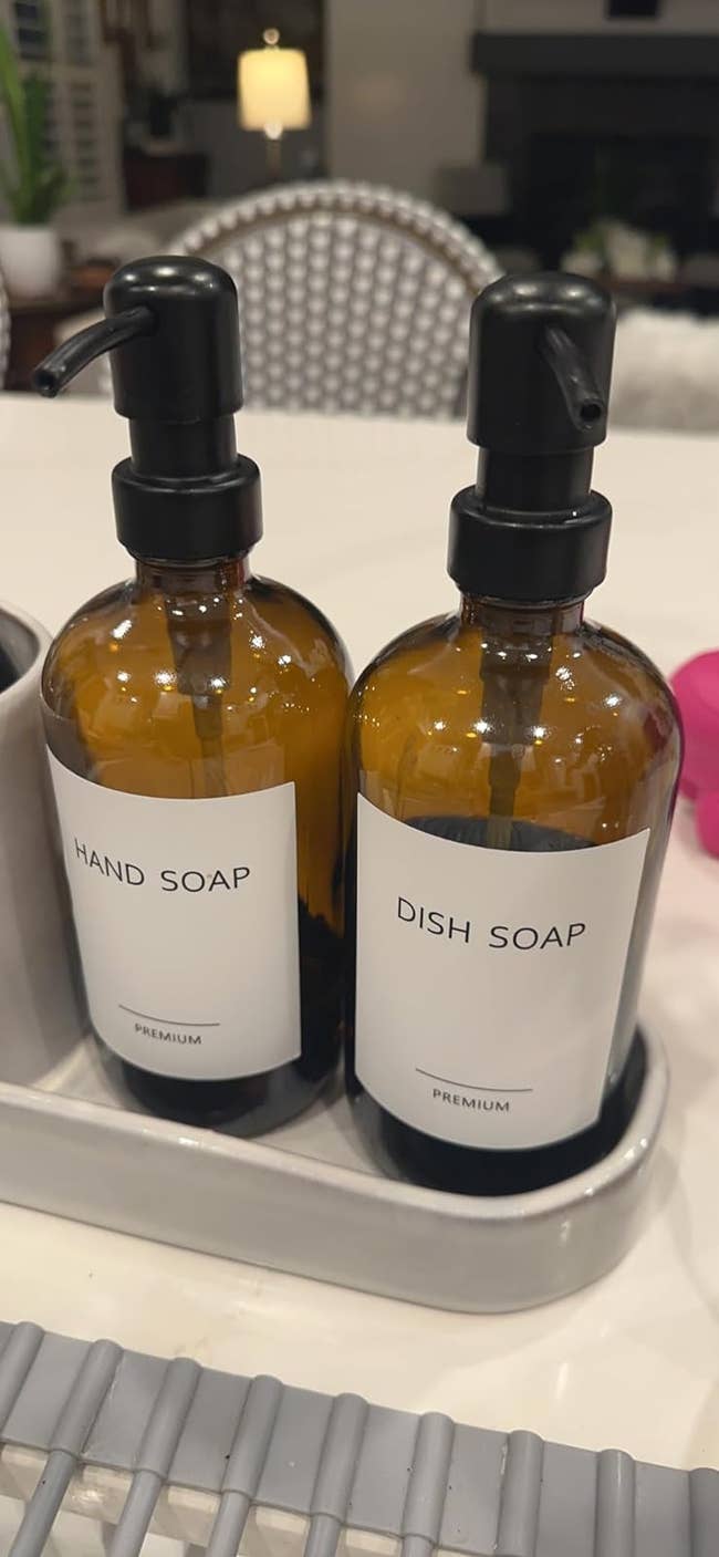 Two brownish pump bottles labeled
