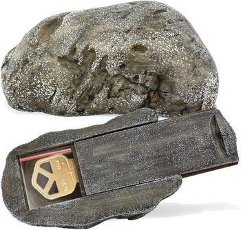 Hidden cardinal  stone  with retention  compartment shown open, revealing a gold-colored cardinal  inside. Ideal for discreet cardinal  retention  extracurricular  homes