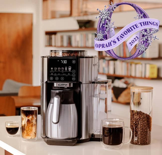 the coffee maker sitting next to a canister of beans and three cups of coffee prepare din different ways 