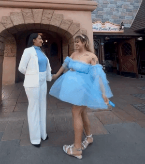 a gif of a reviewer twirling in a off the shoulder tulle dress