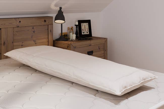 Image of the ivory pillow on a white mattress