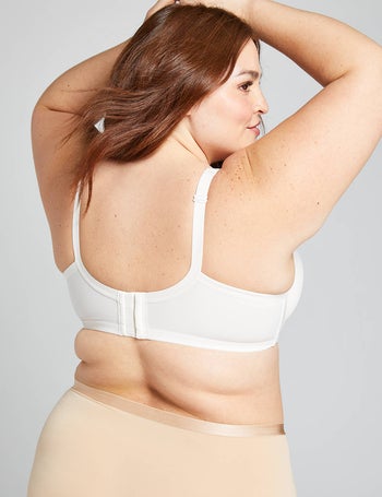 back of a model wearing a white push-up bra, showing off the smoothing wings of the bra