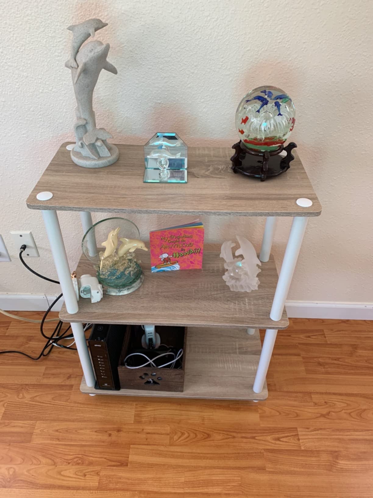 reviewer image of the white and oak shelf with knick-knacks on it