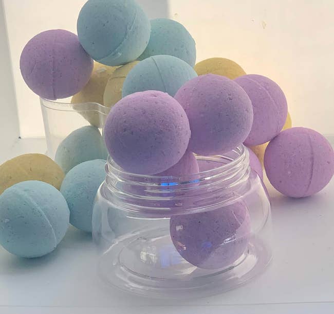 Stack of feet bath bombs placed in glass jar