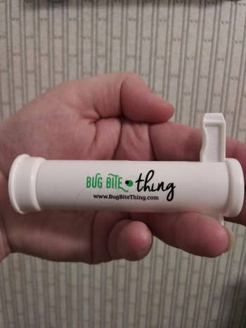 another reviewer holding the bug bite suction tool