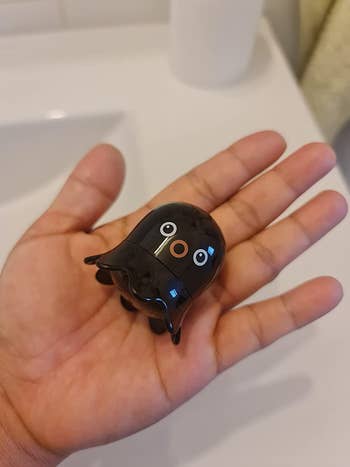 hand holding octopus-shaped blackhead remover
