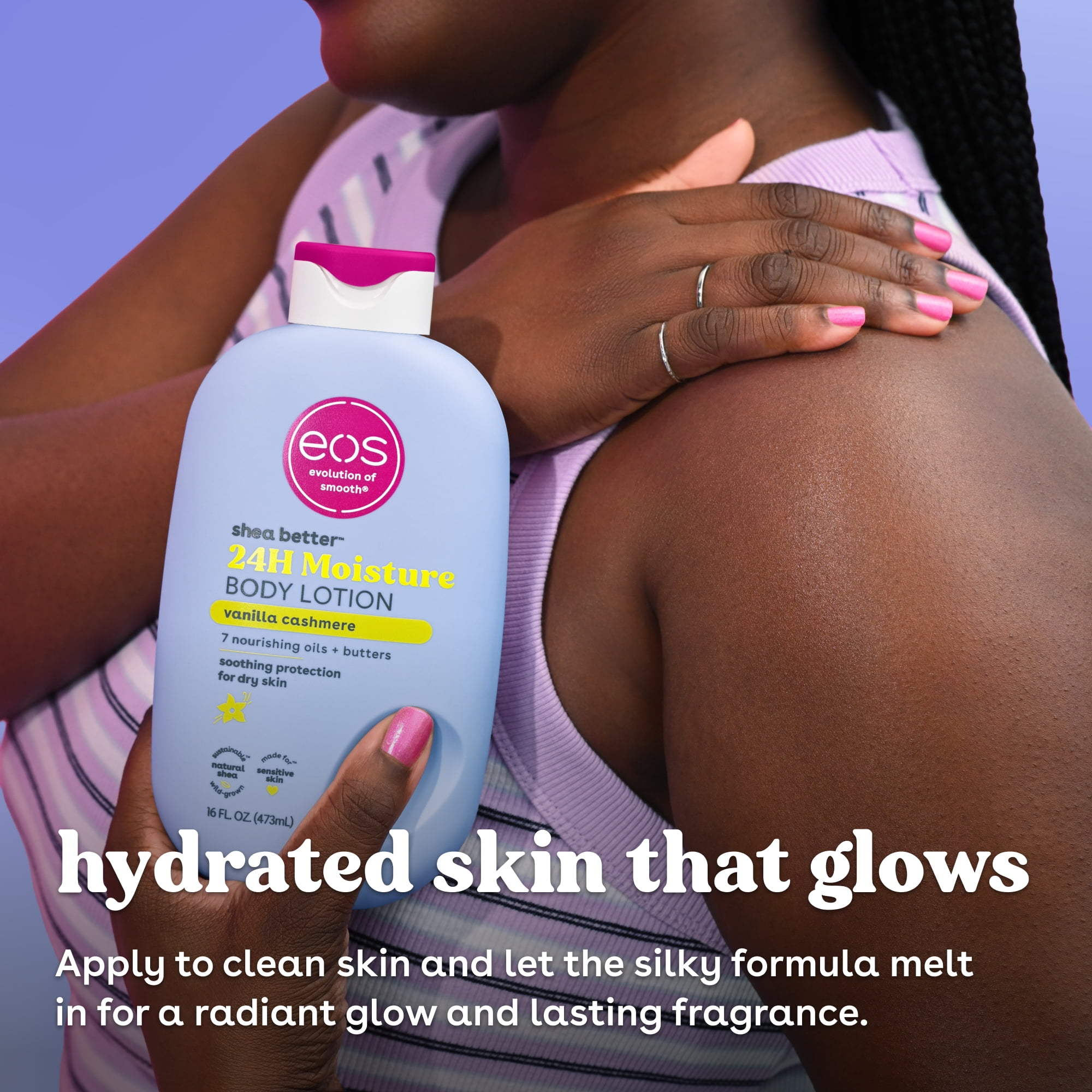 Person applying eos shea food  assemblage  lotion to arm, holding bottle.