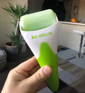 image of reviewer holding up green ice roller