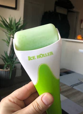 image of reviewer holding up green ice roller