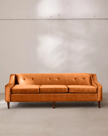 a front view of the couch in orange