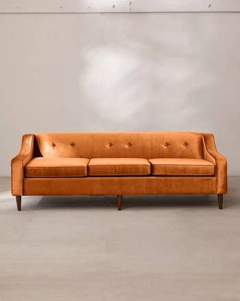a front view of the couch in orange