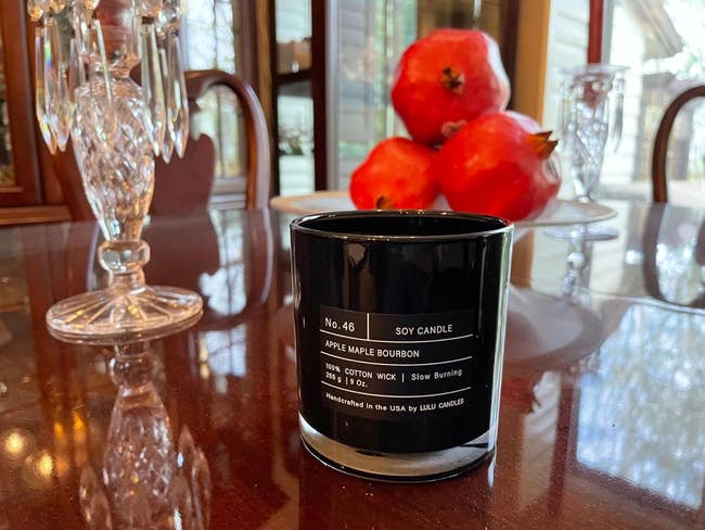 Soy candle successful a achromatic jar labeled