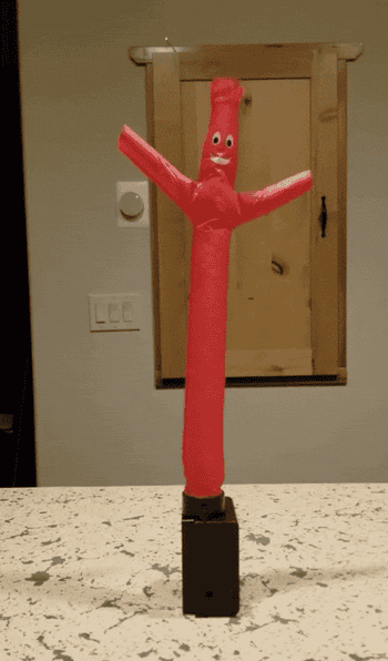 Gif of reviewer using the inflatable tube guy