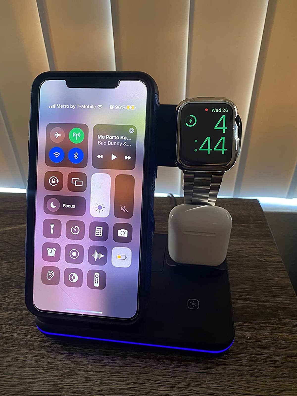Stand on reviewer's night table with phone, watch and AirPods plugged in and no visible cords