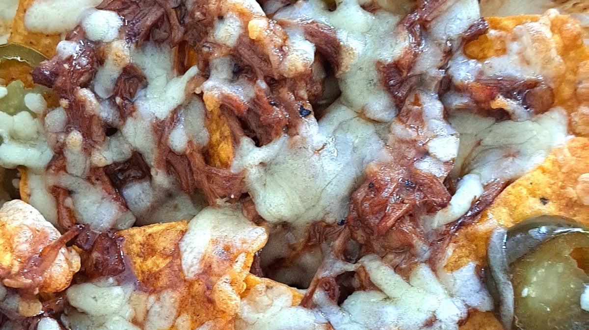 Loaded Pulled Pork Nachos Recipe by Tasty image