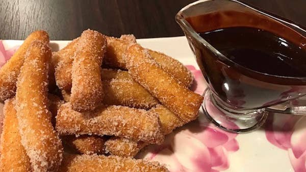 Delicious Churros With Chocolate Sauce