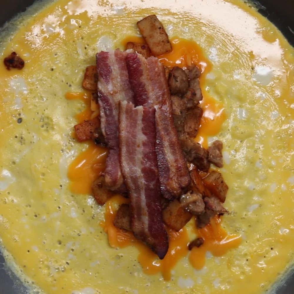 Bacon & Sausage Egg Wrapped Breakfast Burrito Recipe by Tasty