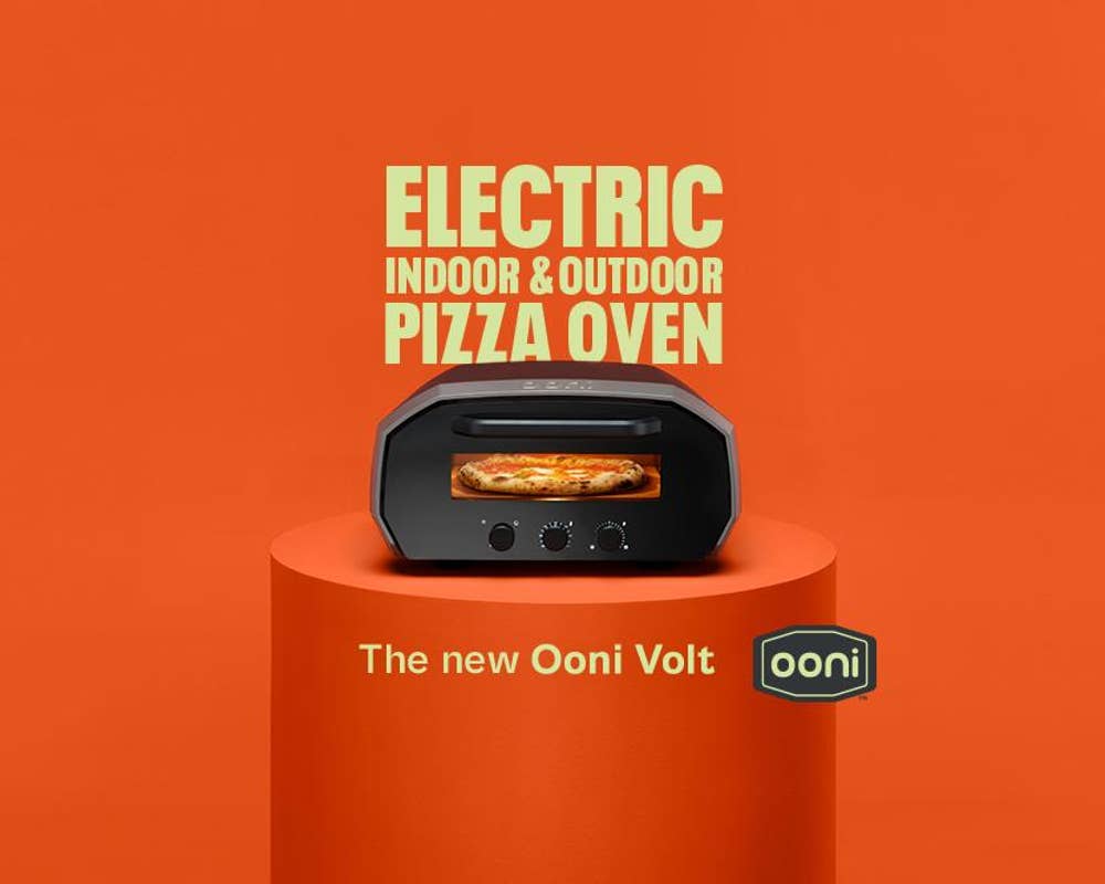 an Ooni volt pizza oven sits on a table under text