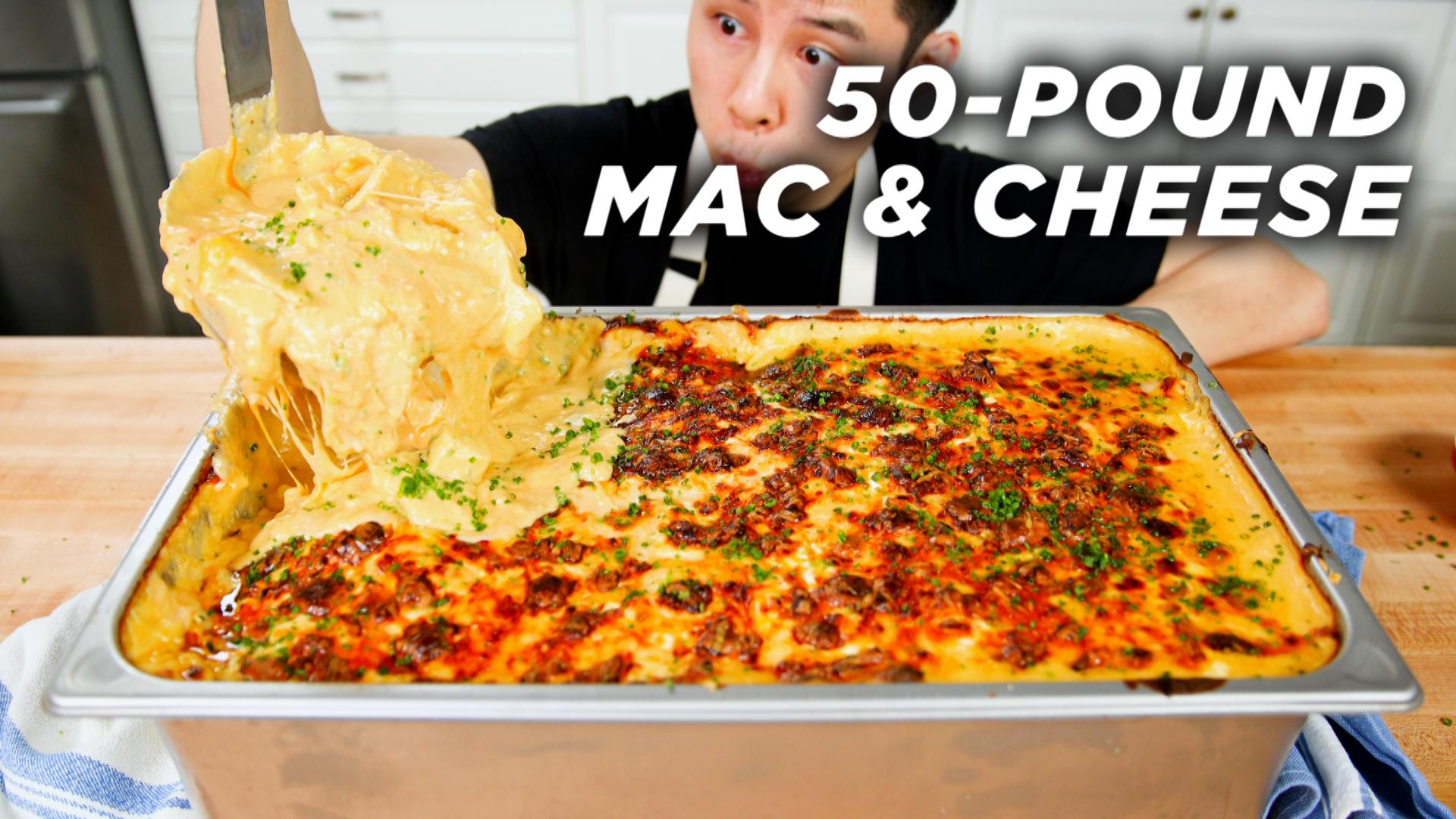 Alvin scoops a huge macaroni and cheese dish from a pan.