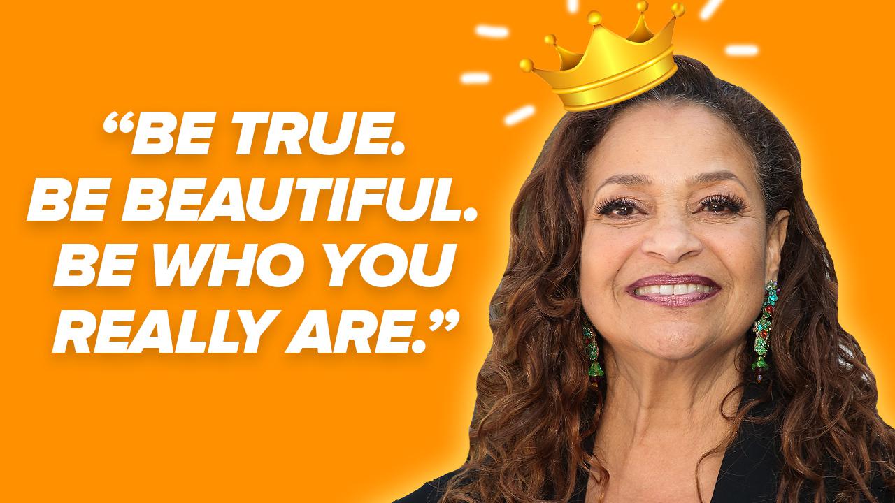 Woman with a crown looks to camera