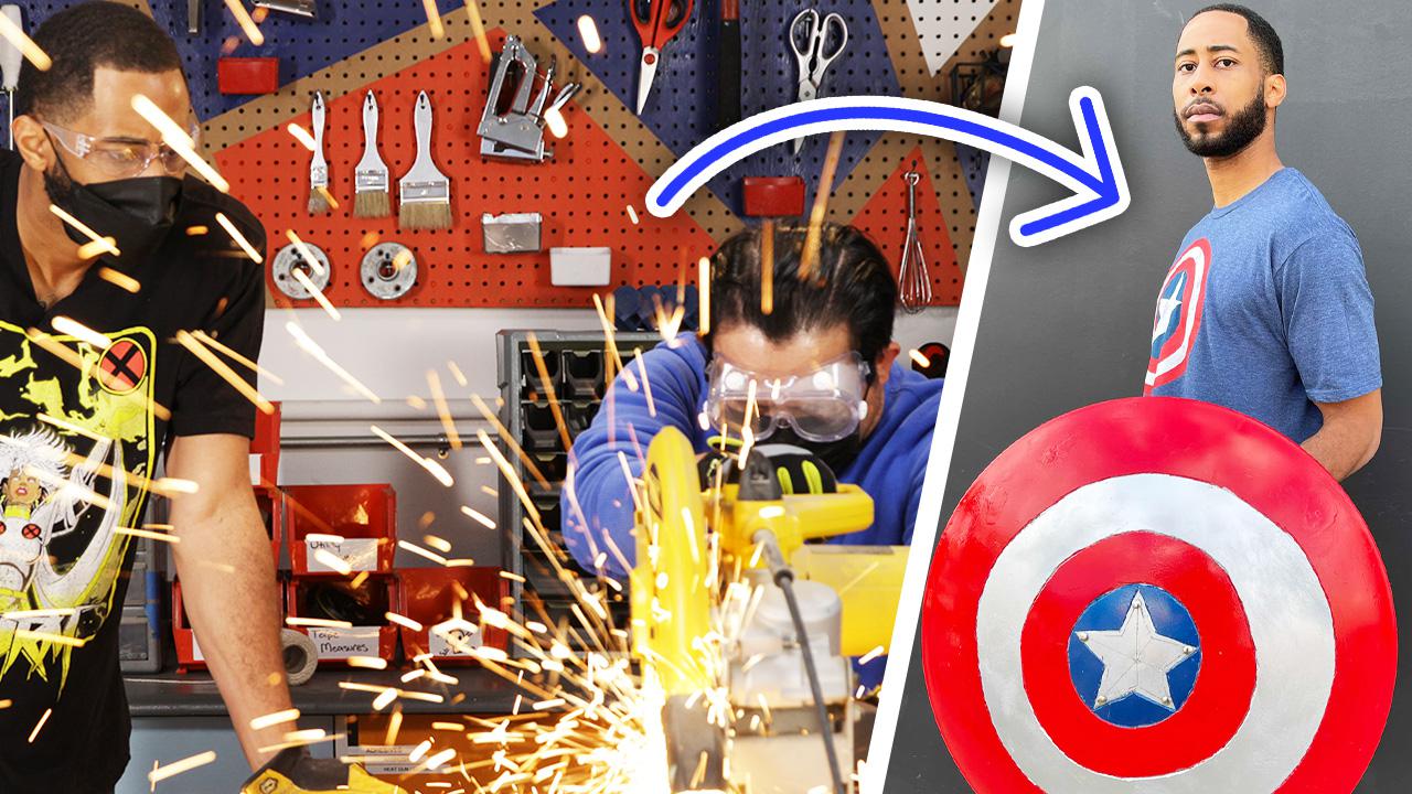 Jeff builds a shield on the left while holding the finished shield on the right.