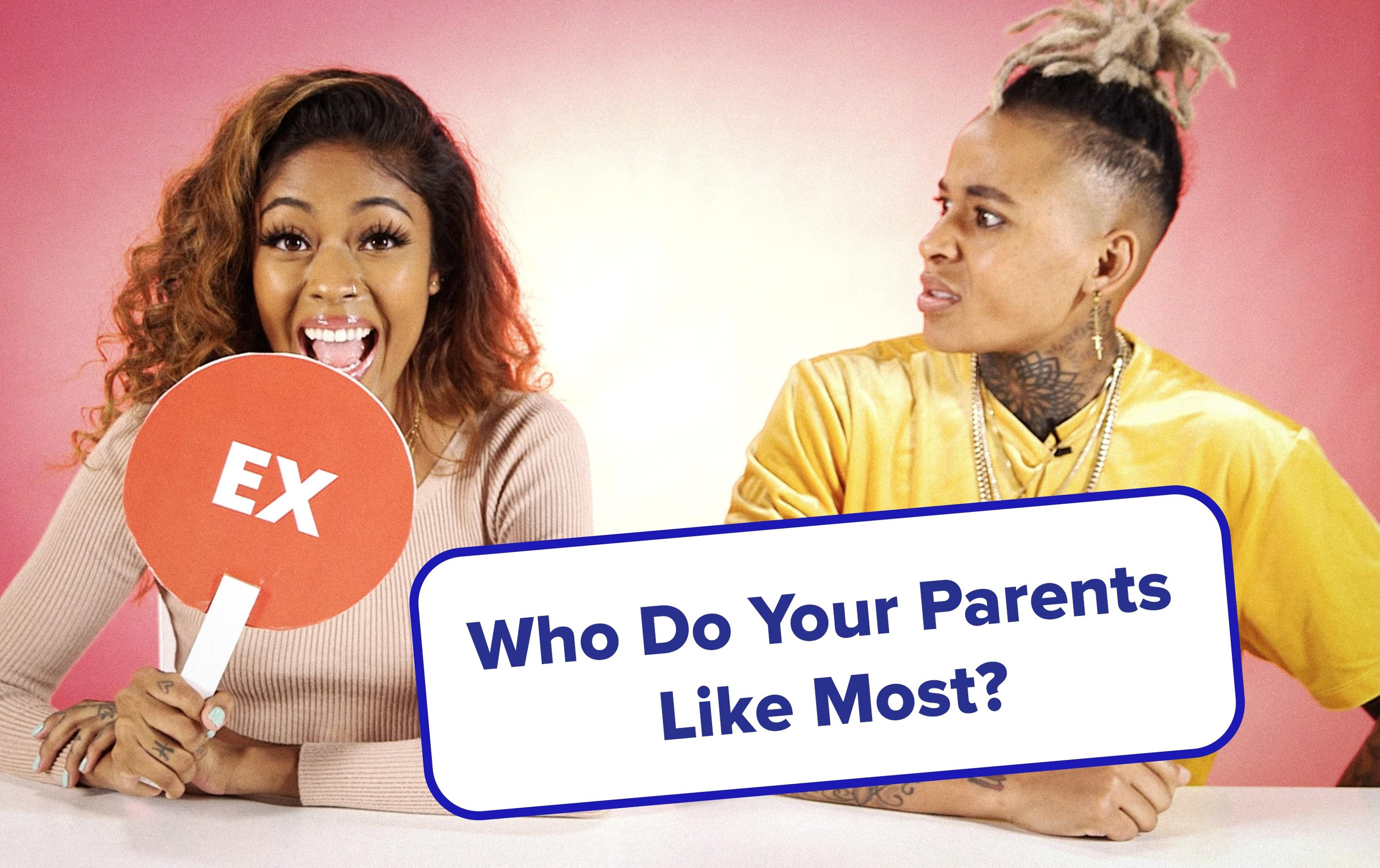 Chess holding up Ex sign with Hazel looking at her.