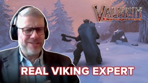 Anders reacts in front of a Viking video game character