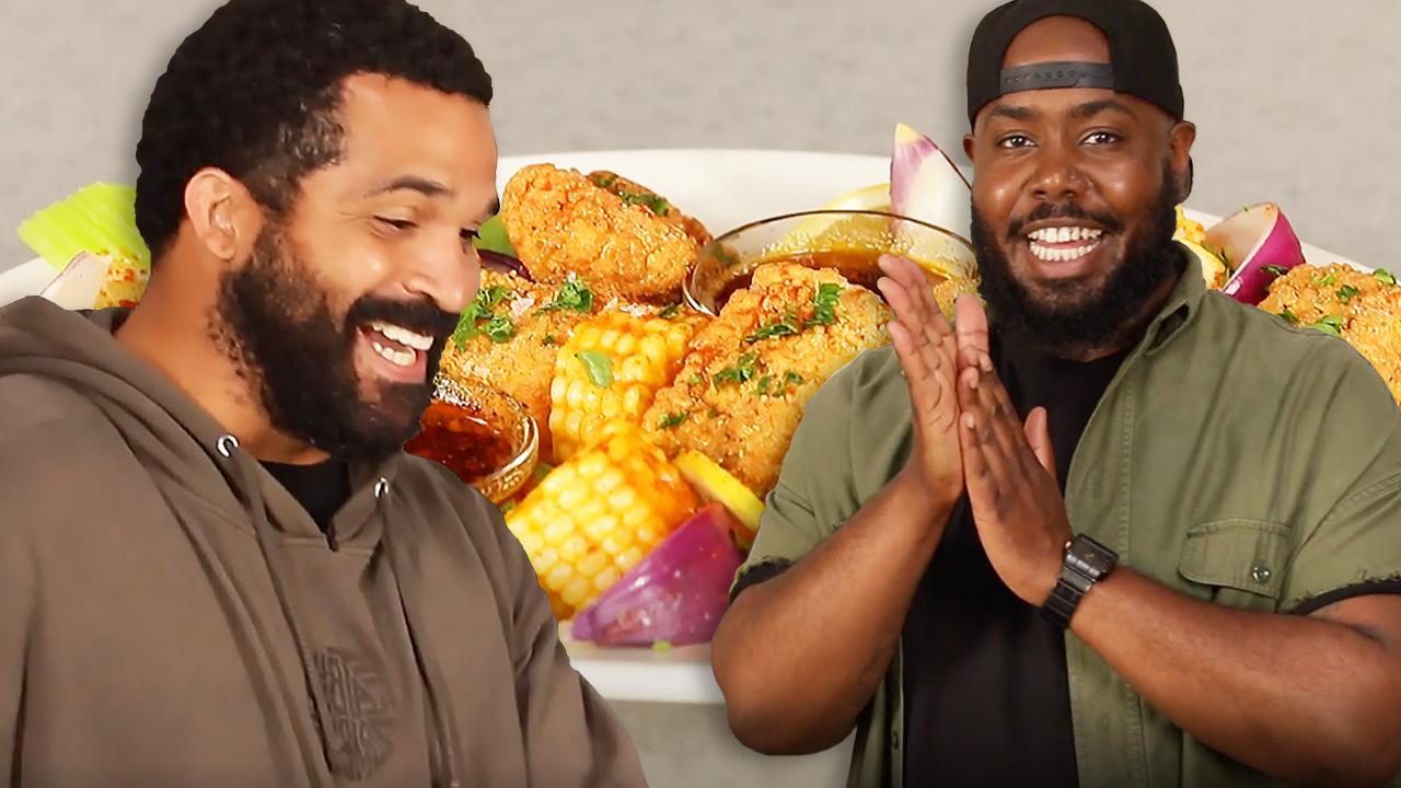 Troy looks at Seafood Broil with Seth.