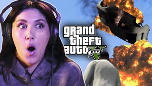 Sydnee looks shocked in front of an explosion from GTA V