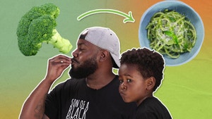 Chef Seth next to broccoli with his son Selassie.