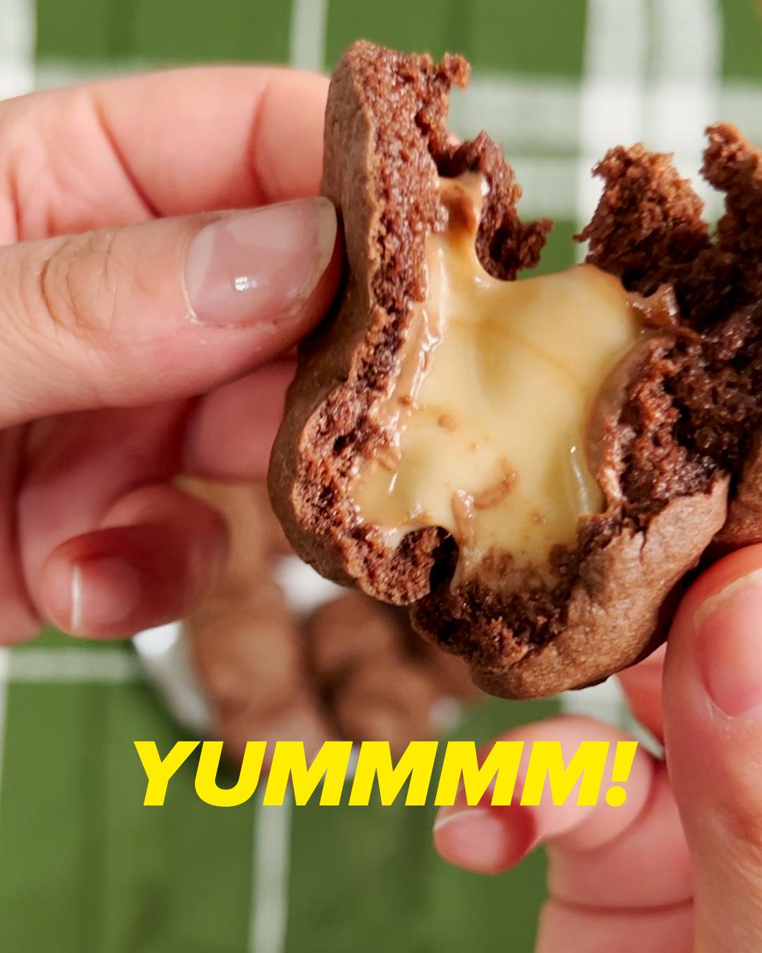 Cookie being torn open, caramel dipping out