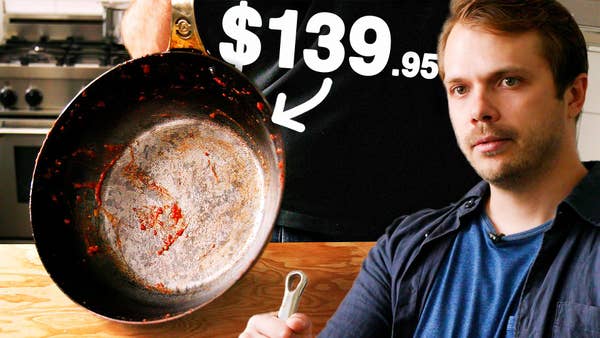 Andrew looking sad with a dirty frying pan labeled "$139.95"