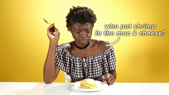 Selorm stares hesitantly at a plate of mac & cheese. A text bubble reading 