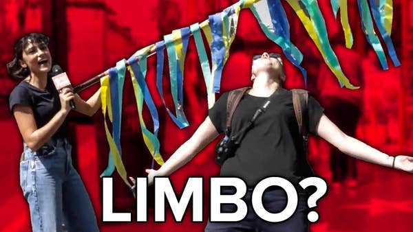 Carolina holds a colorful limbo stick over a tourist wearing a camera around their neck, limboing underneath. The text reads, "Limbo?"