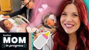 Hannah smiles on the right, her baby sits in a carseat with a bottle emoji in the center and Hannah holds her baby girl with Matt looking on with pride on the left. The text reads, "BuzzFeed Mom in Progress."