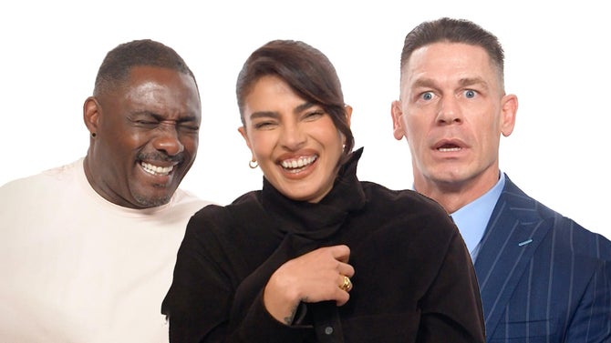 Idris Elba, Priyanka Chopra, and John Cena laugh and look shocked. 