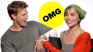 Zoe Kravitz and Austin Butler smile and react to each other. In the background the Buzzmoji "OMG" can be read.