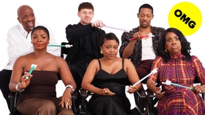 The cast of "Abbott Elementary" sit together and point at each other with finger pointers. 