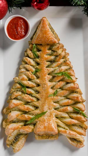 Closeup of a puff pastry in the shape of a twisted, braided Christmas tree.