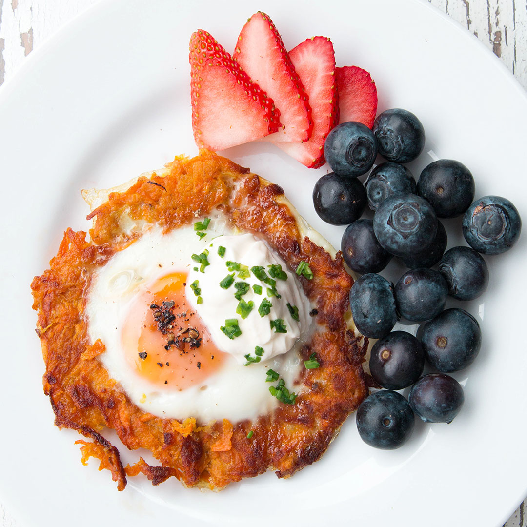 Spiralized Sweet Potato Egg in a Hole - Eat the Gains